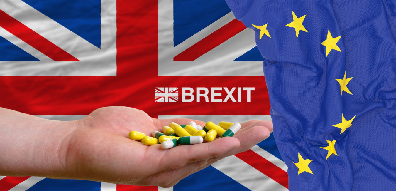 A hand holding pharmaceutical drugs with the UK and EU flags in the background, representing the impact of Brexit MA Holders on the pharmaceutical industry.