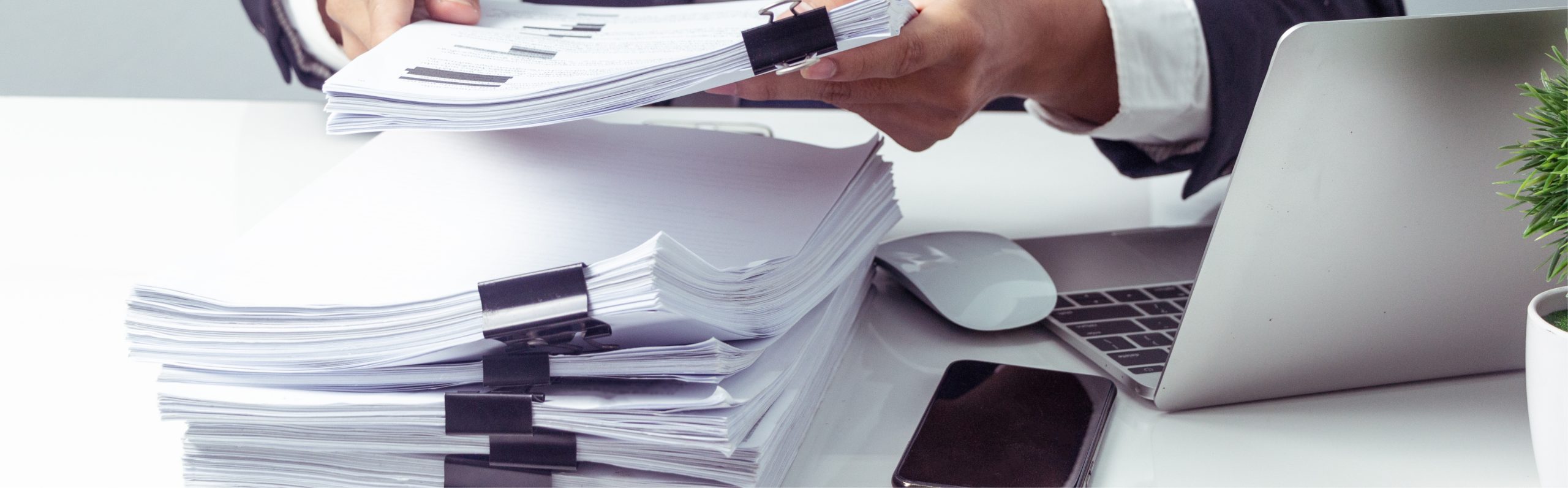 A specialist in medical writing organizing and arranging documentation, symbolizing the meticulous preparation and high-quality services essential for successful registration of medicinal products. This process involves preparing detailed dossiers for approval by regulatory agencies, minimizing regulatory risks, and ensuring compliance with various guidelines for non-clinical and clinical data, clinical trial reports, and other regulatory submissions.