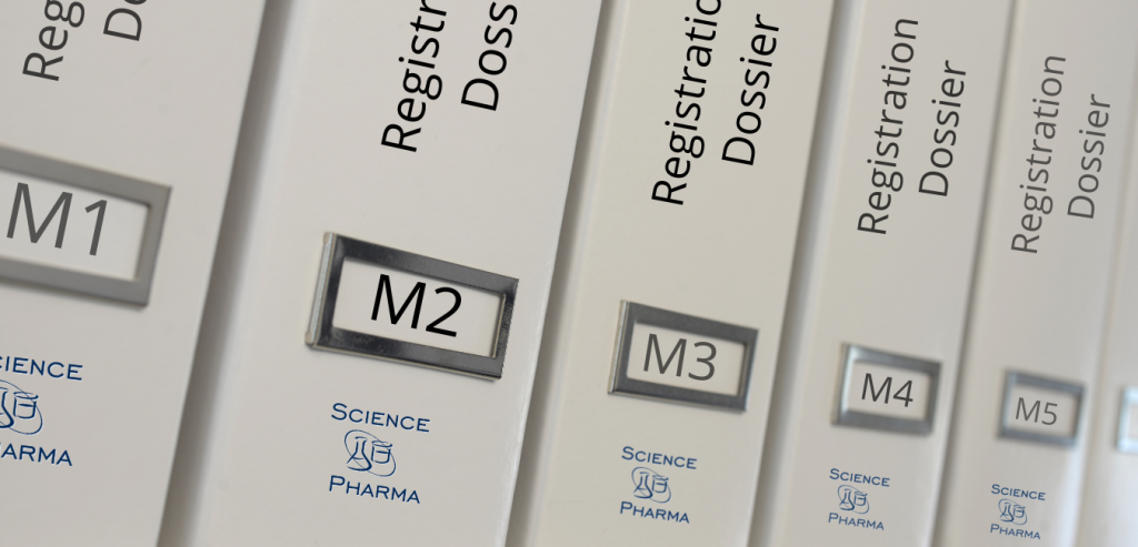 Close-up of organized binders labeled 'Registration Dossier' on a shelf, symbolizing comprehensive and high-quality medical writing services essential for the successful registration of medicinal products. These services include the preparation of non-clinical and clinical documentation, clinical trial reports, and various regulatory submissions, aiming to minimize regulatory risks and ensure timely project completion.