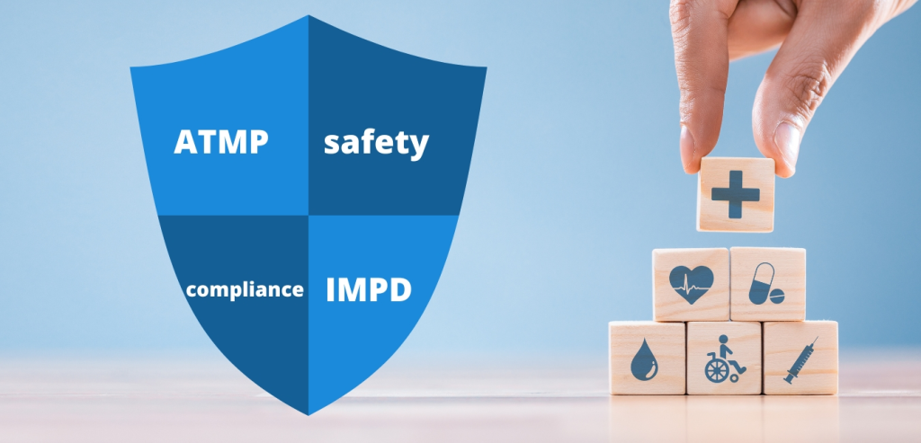 wooden blocks arranged in a tower, each of these blocks has a medical symbol on it. In the middle, the shield that is divided into four parts, on each part is written: ATMP, safety, compliance, IMPD.